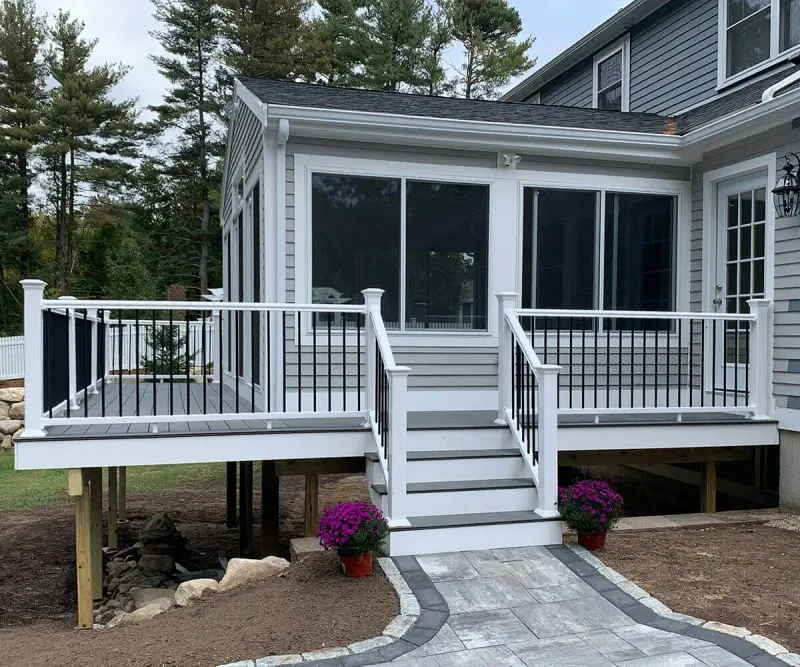 Custom pergola over an outdoor living space with composite decking in southern NH