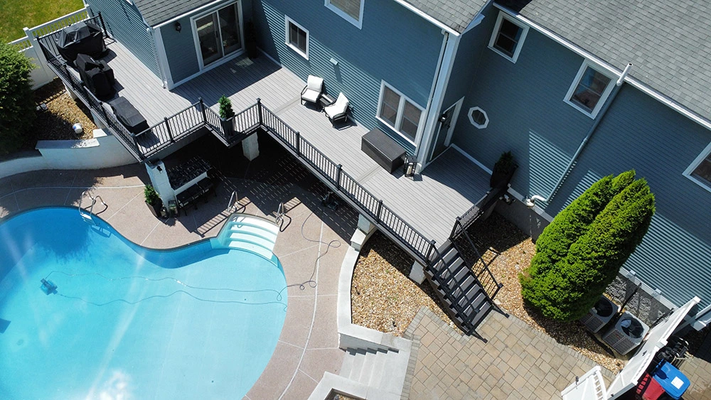 Composite deck mid-construction showing steel framing and decking installation from aerial perspective