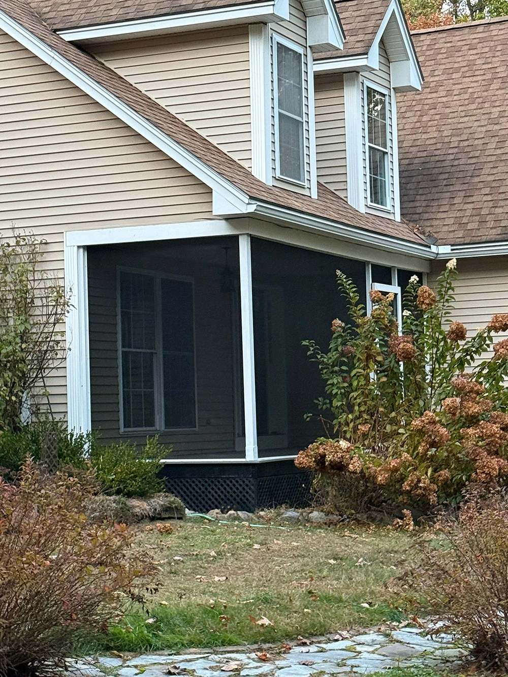 Custom pergola over an outdoor living space with composite decking in southern NH